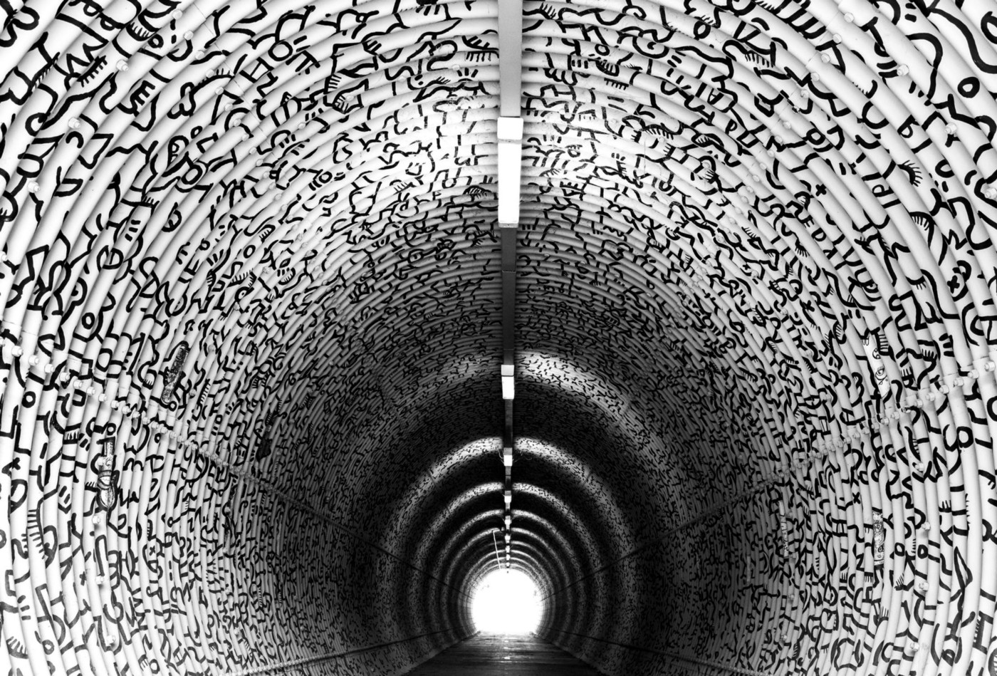 Picture of a tunnel with a light at the end of it.