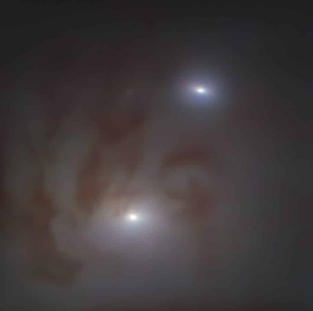 Tampilan close-up dari sepasang lubang hitam supermasif terdekat
