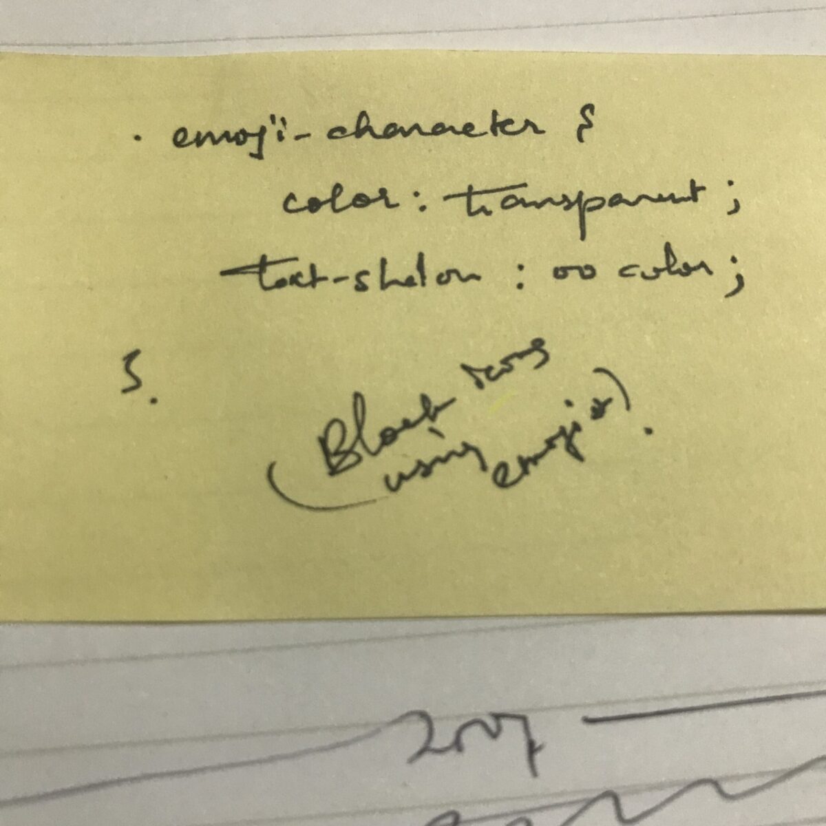 Papier jaune non ligné avec code manuscrit en cursif à l'encre noire.