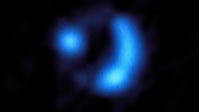 Polariserat damm avslöjar ett starkt magnetfält i den antika galaxen – Physics World