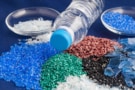 Photo of plastic pellets and bottle
