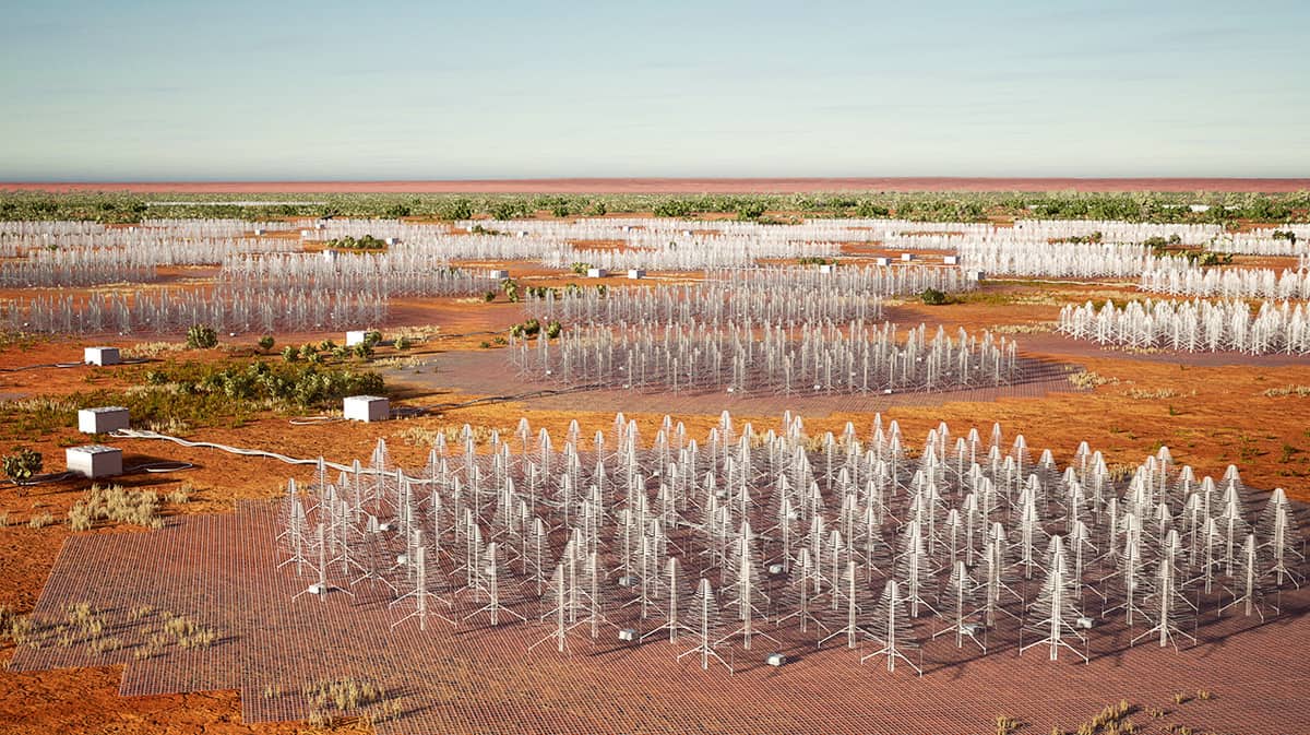 Groot woestijngebied met verschillende cirkelvormige groepen van honderden kleine antennes