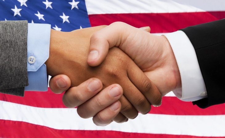handshake and american flag