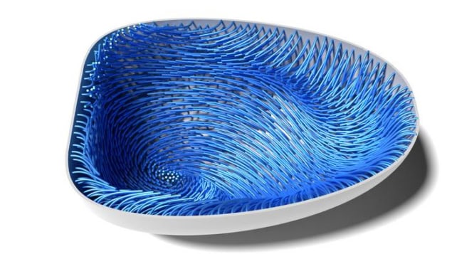A snapshot from a simulation of how microtubules bend and direct material in a maturing egg cell into a twister-like flow. The simulated egg cell looks like an upturned blue dish with swirling patterns